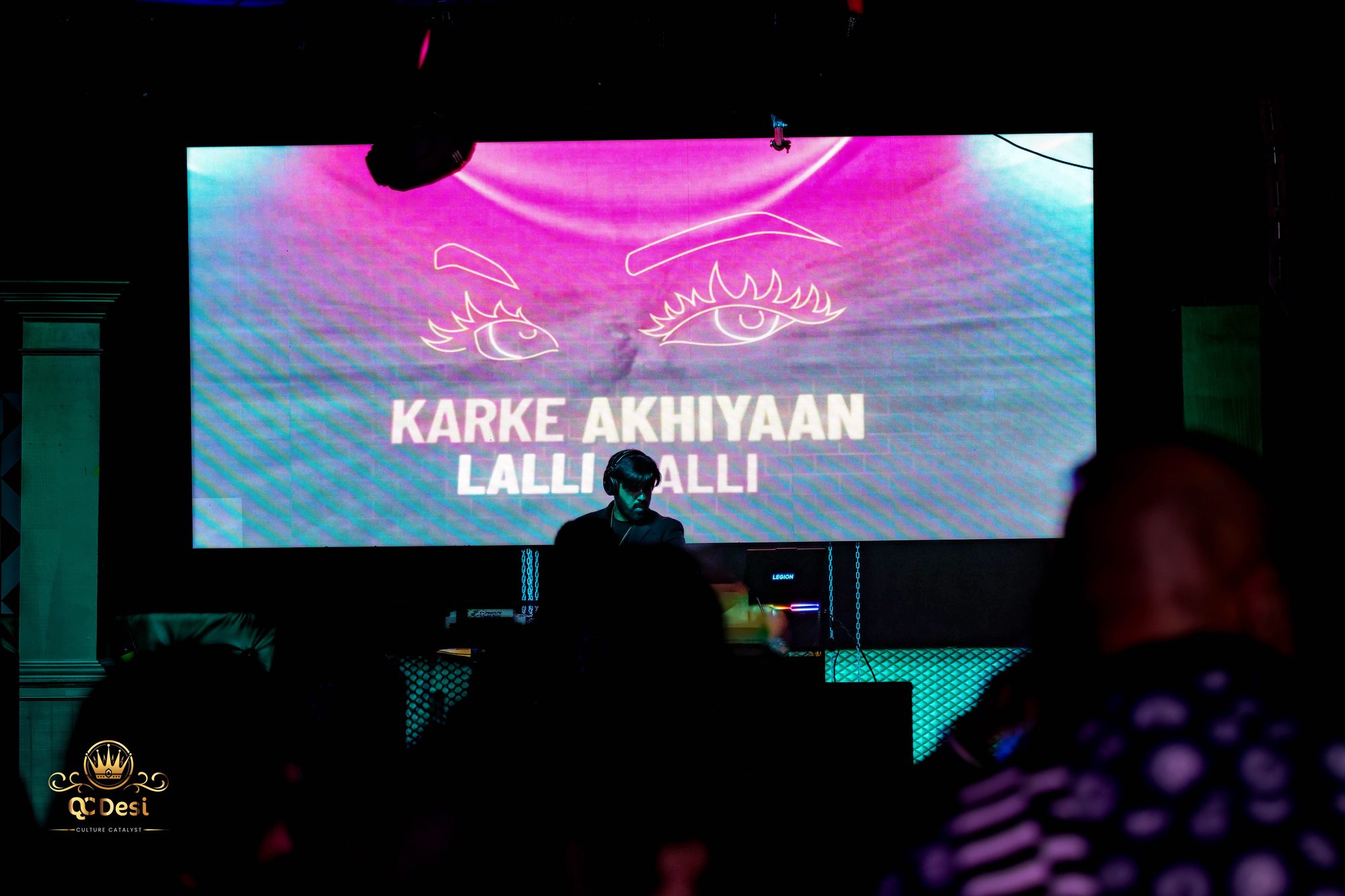 Karke Akhiyaan lyrics glowing on the video wall above the DJ
